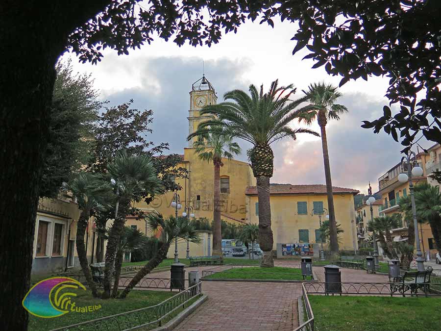 Small square and bell tower of the Church of the Madonna del Carmine (Porto Azzurro)