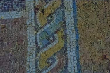 Polychrome mosaic decorated with hinged geometric motifs